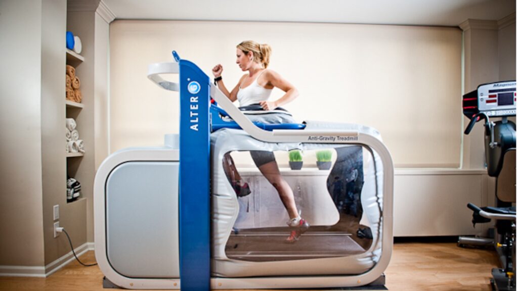 Image of a woman running on a specialised anti-gravity treadmill.